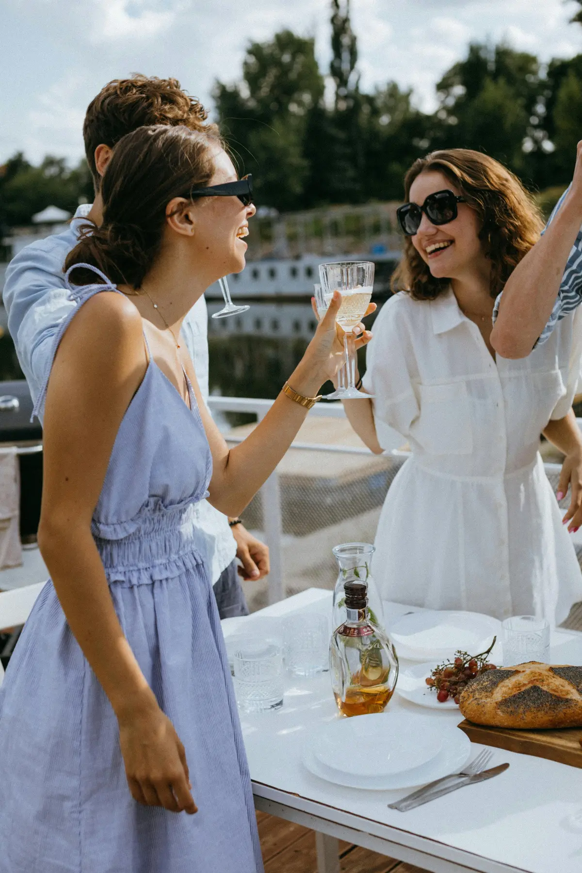 Group of friends having fun on a boat