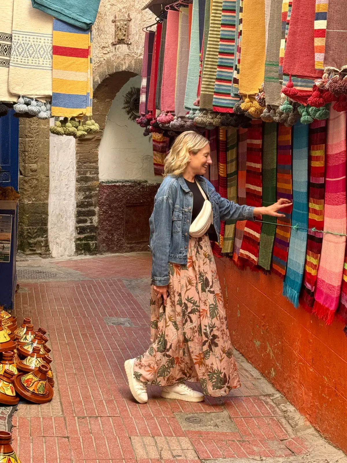 Julie Hartigan browsing textiles in a Moroccan souk