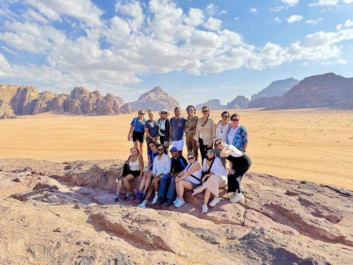Julie Hartigan with a group in the desert