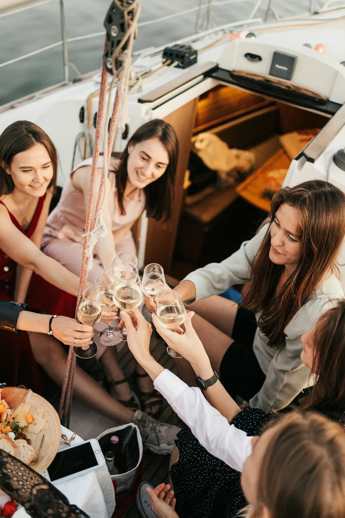 A group of girlfriends celebrating and toasting