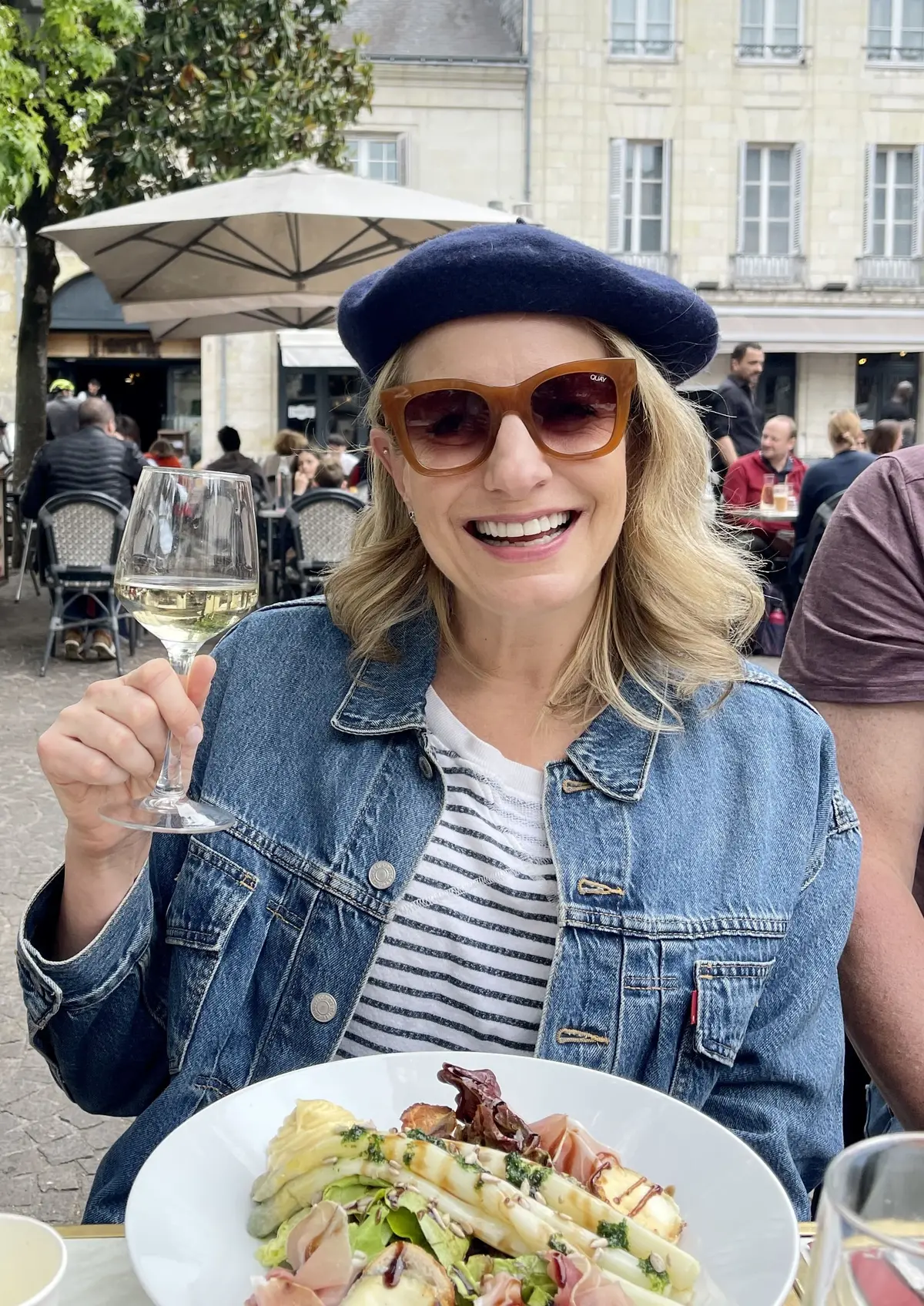Julie Hartigan in Paris eating and sipping wine