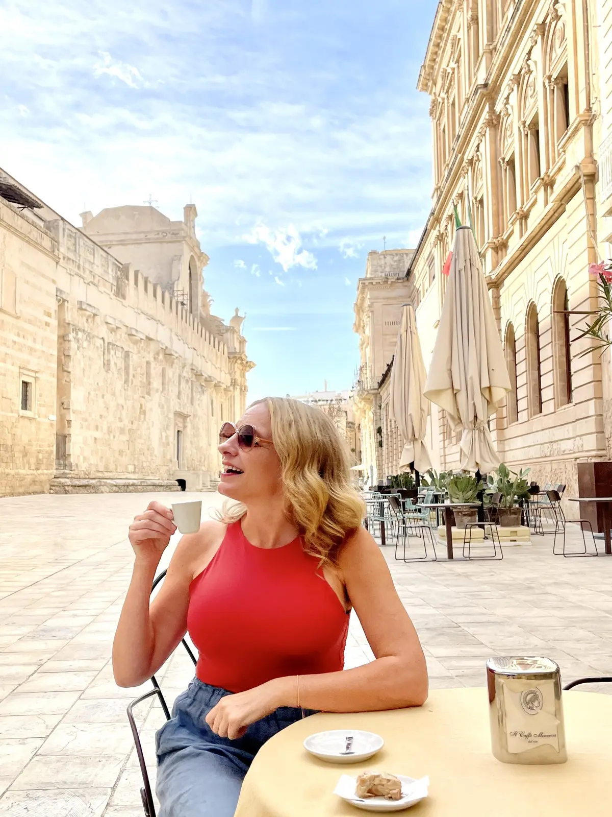 Julie Hartigan sipping a coffee in Ortigia, Sicily