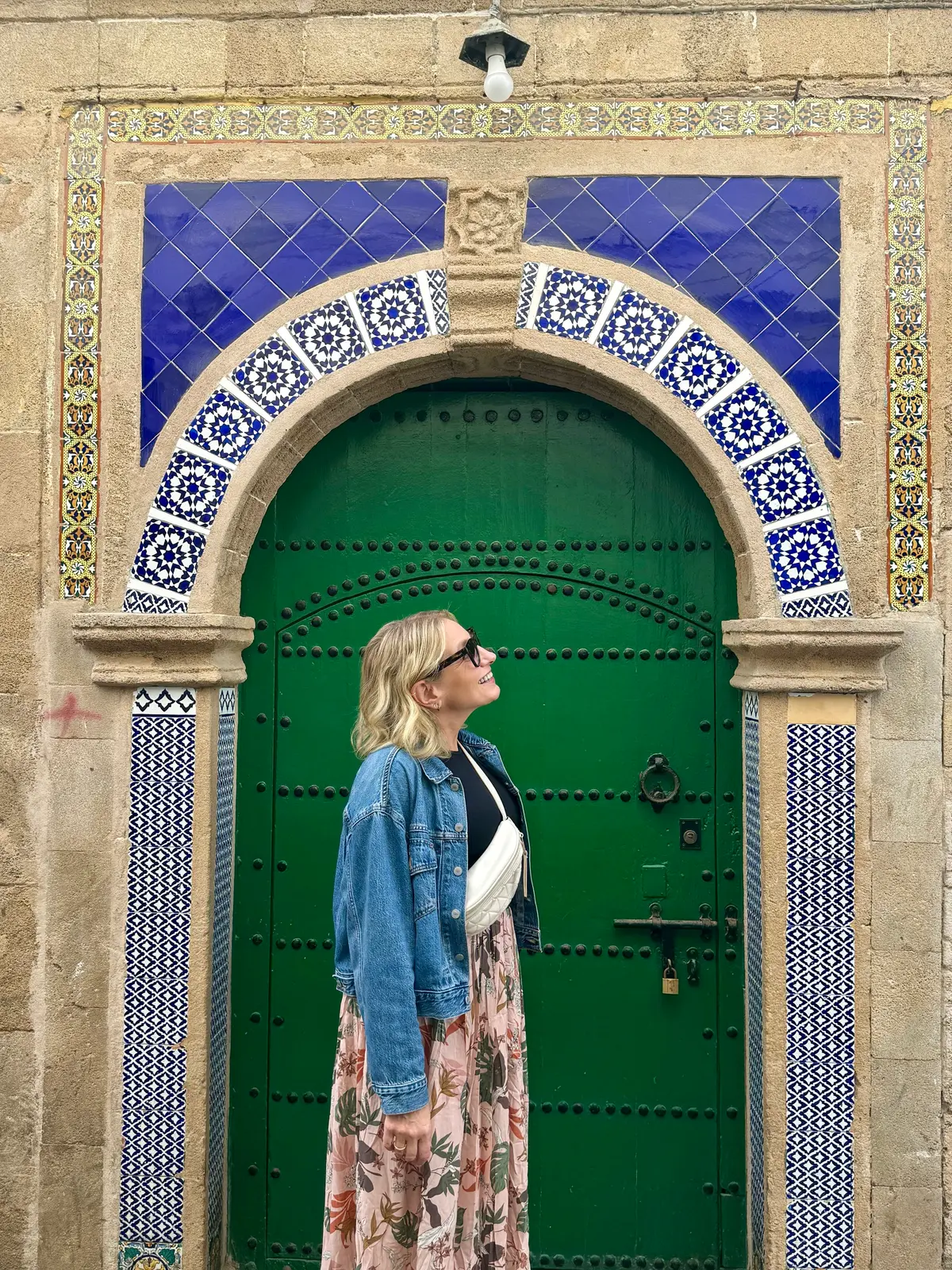 Julie Hartigan at a green door in Morocco