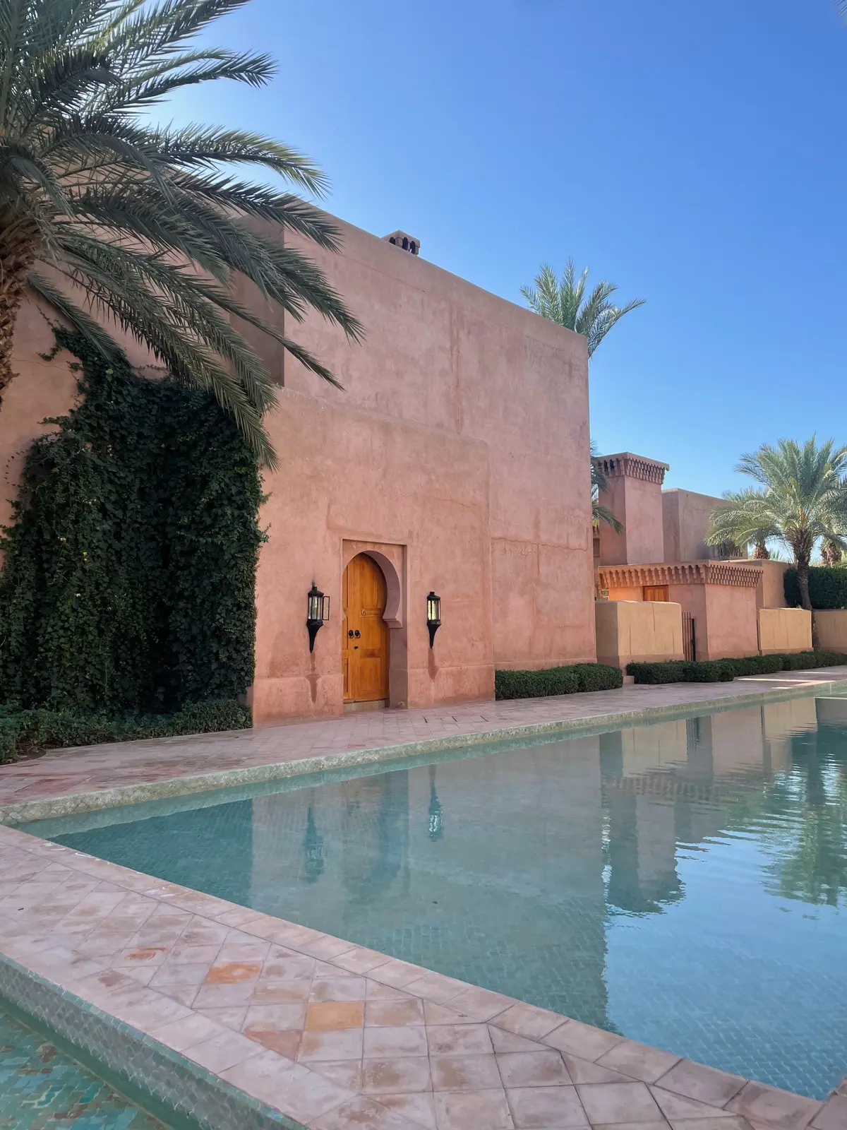 A pink riad courtyard pool in Marrakech
